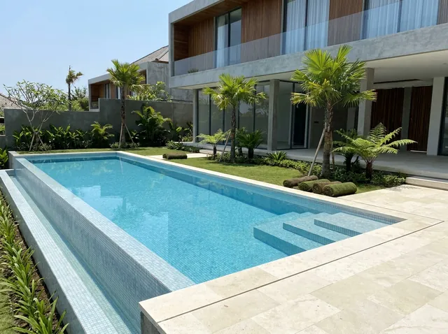 Newly built infinity pool and tropical garden landscaping at a Bali villa